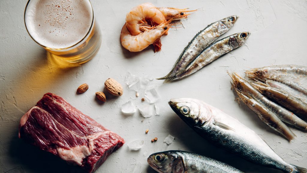 High purine foods to avoid with gout including red meat, sardines, shrimp, liver, and beer